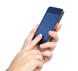 female hands holding a phone and touches the screen